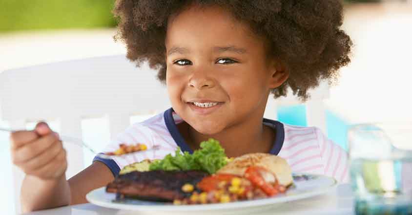 Kid eating from a plate