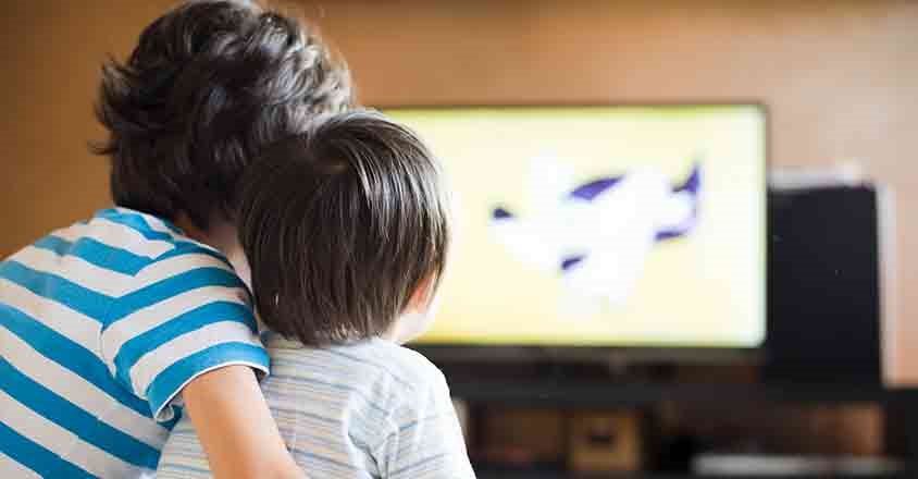 brothers watching tv together