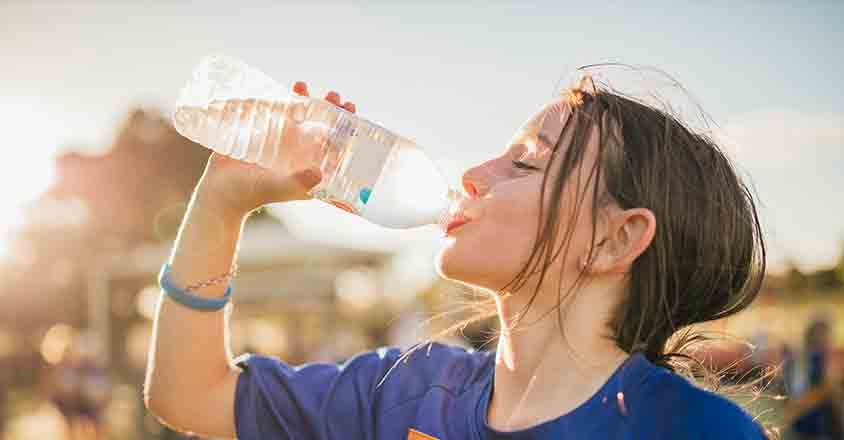 girl drinking water bottle