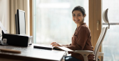 woman sitting straight at desk