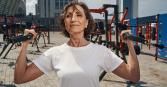 older women who is in great shape, working out at an outside gym